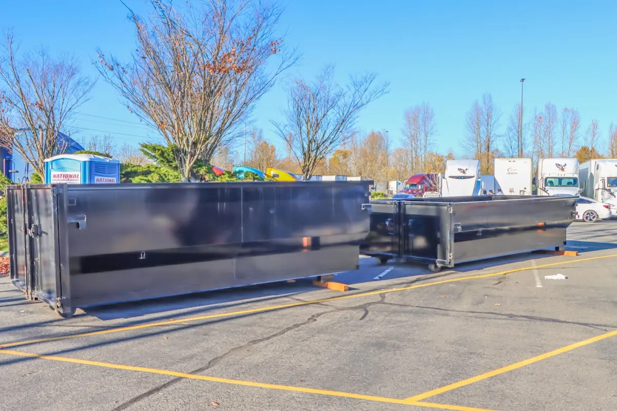 Professional dumpster rental service with roll-off container on residential driveway in Turpin Hills